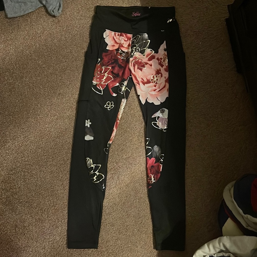Justice Silk black leggings with flowers. Has pockets.
